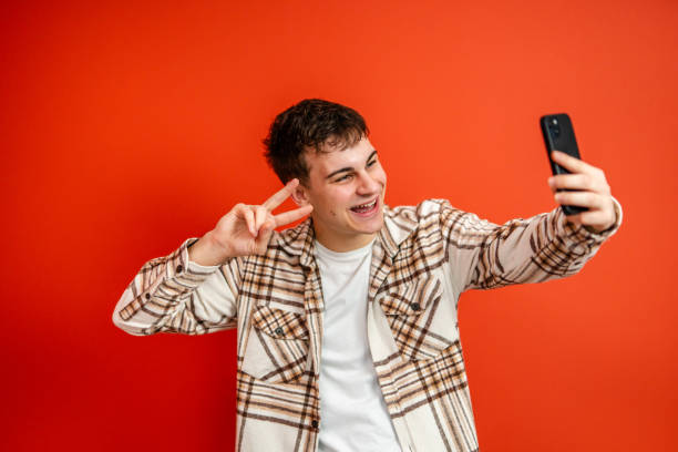 istock young man make have a video call on mobile phone talk studio shot 2196991673
