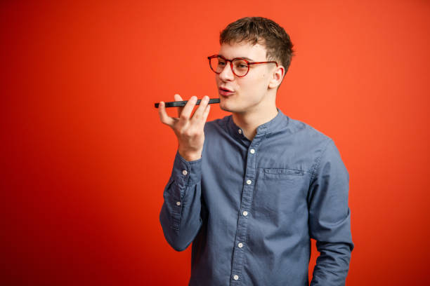 istock man left voice mail on mobile phone stand in front red background 2196993165