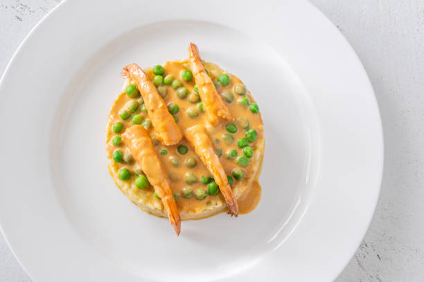 Risotto with shrimps, bisque sauce and green peas