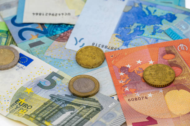 istock Euro Banknotes and Coins Close-Up 2196999261