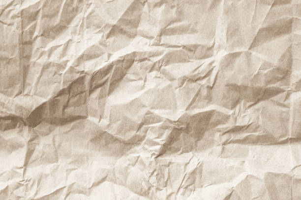 Old paper vintage texture surface for background. Recycle pale brown paper crumpled texture, Cream color recycled kraft paper texture blank with copy space for text.