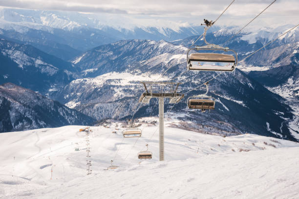 istock Ski resort slope and ski lft. Alpine ski / snowboard vacation. 2197004063