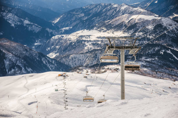 istock Ski resort slope and ski lft. Alpine ski / snowboard vacation. 2197004064