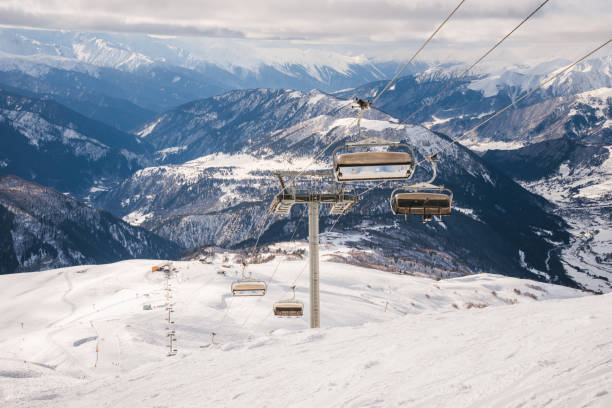 istock Ski resort slope and ski lft. Alpine ski / snowboard vacation. 2197004066