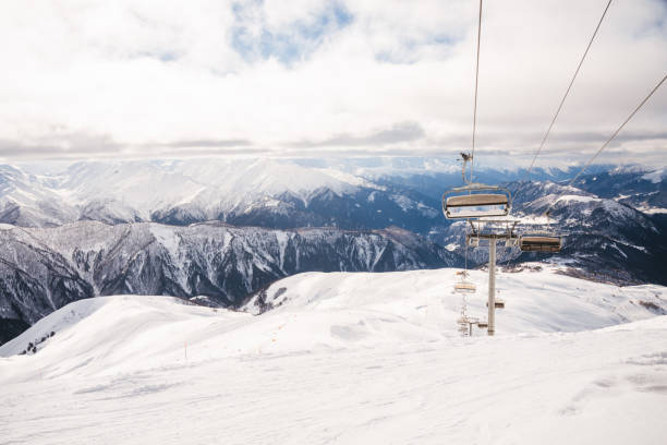 istock Ski resort slope and ski lft. Alpine ski / snowboard vacation. 2197004071