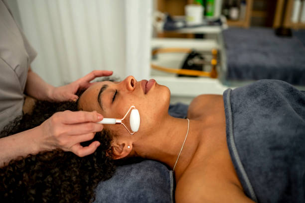 istock Relaxing Facial Massage with Jade Roller 2197004474