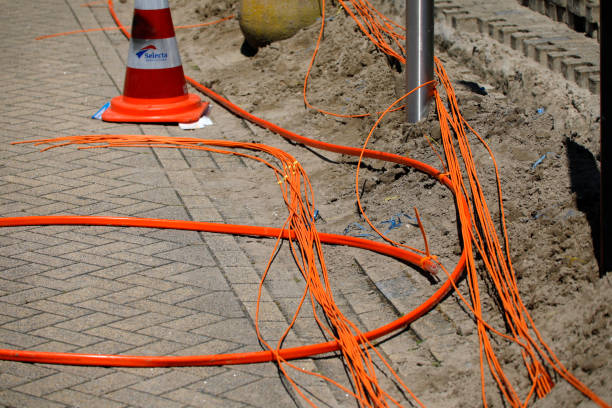 istock Installing and connecting fibre optic cables to houses 2197004549