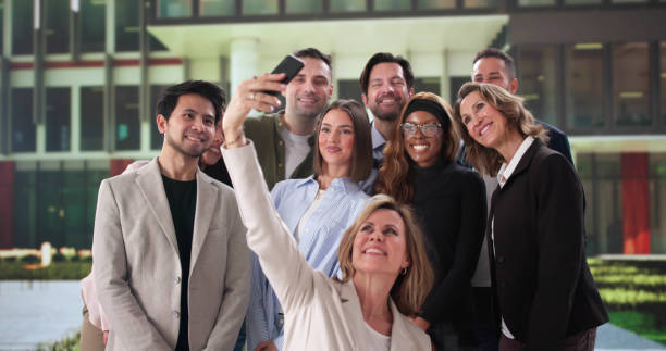 istock Multiracial Business Team Smiling Together Taking Selfie 2197012436