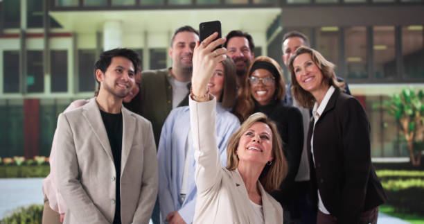 istock Multicultural Business Team Celebrating Success with Group Selfie 2197012437