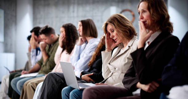 istock Unemployed job seekers wait in line 2197012456