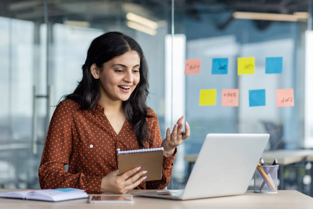 istock Woman Having a Video Meeting on Laptop While Taking Notes 2197013393