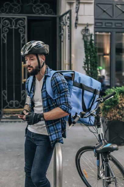 istock Urban Cycle Courier Taking a Break in the Evening 2197013735