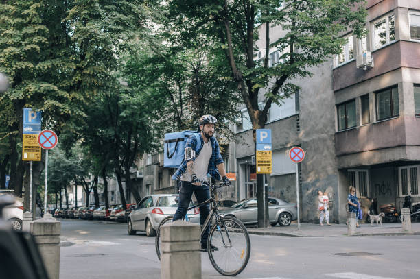 istock Cyclist Delivery in Urban Setting During Daytime 2197013737