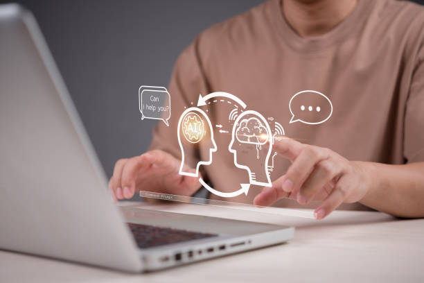 istock Human and AI interaction in modern technology. A person using a laptop with virtual assistant and deep learning, representing intelligent automation and innovation. digital assistant conversation 2197017310