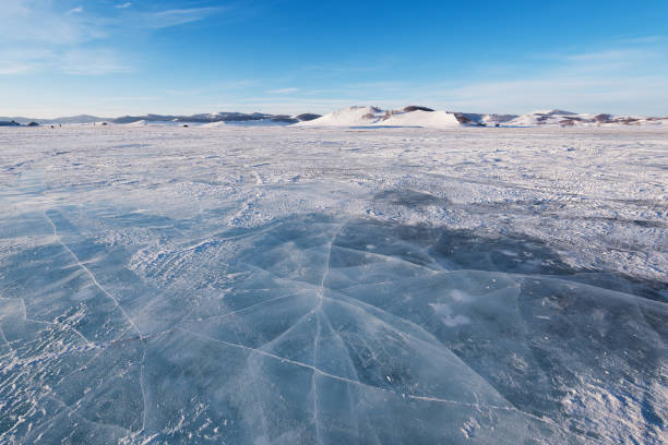 istock The snowy grassland with blue sky and white clouds is very beautiful 2197018220