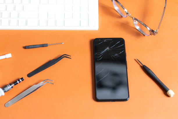 istock Smart phone Repair Tools on Orange Desk 2197019602