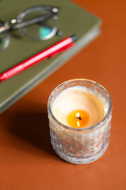 istock Cozy Workspace with Candle and Stationery 2197019805