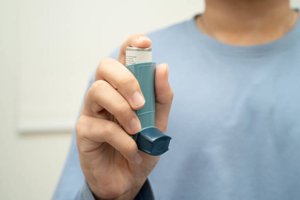 istock Asthma and chronic obstructive pulmonary disease COPD, Asian young man using metered dose inhaler MDI. 2197020162