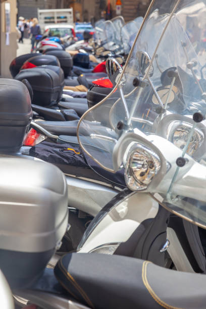 istock Several Motorbikes Parked on a Sunny Summer Street 2197034774