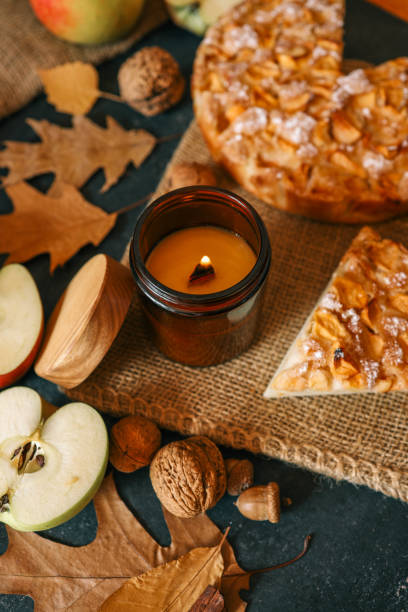 istock Candle and homemade apple pie, autumn mood 2197036110