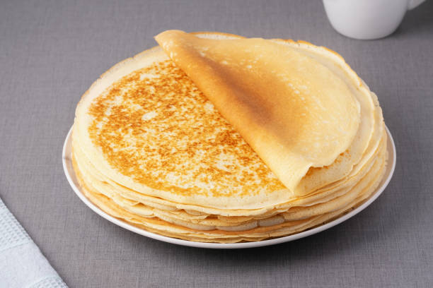 istock Stack of traditional russian pancakes blini on gray background. Homemade russian thin pancakes blini. Russian food, russian kitchen 2197036791