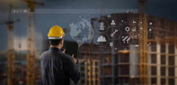 istock smart construction project A man is looking at a tablet with a construction site in the background 2197039565