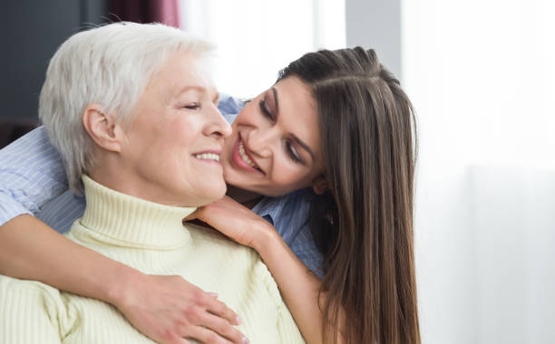 istock Happy daughter hugging her mother with love 2197039727