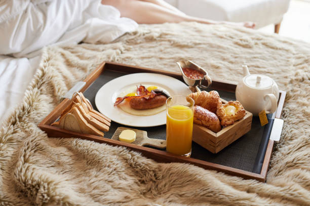 istock English breakfast on a tray on a fluffy blanket in a hotel 2197040176
