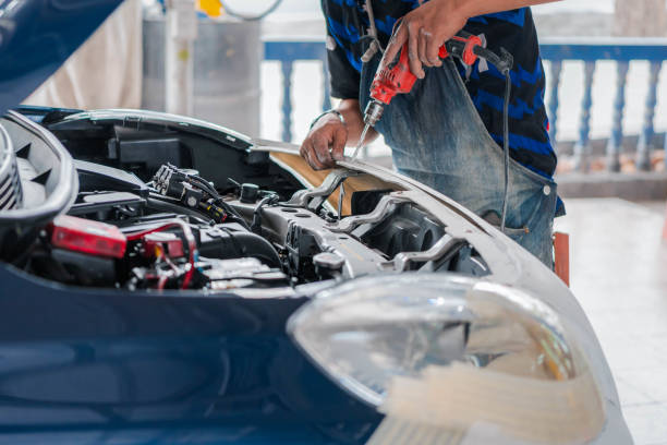 istock Checking car body work fiber bumper at car garage 2197040321