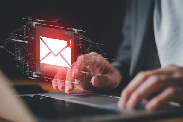 istock Business man using smartphone and computer that show warning sign after got attack phishing email by malware from hacker that commit cyber crime or software crash to cause an error. 2197041060