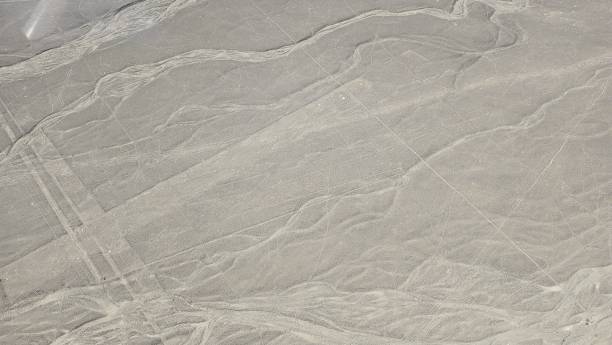 istock Geometrical Geolyphs on the plain of Nazca Lines dried river bed 2197042172