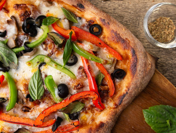istock Homemade Sourdough pizza on Wooden Table. 2197043944