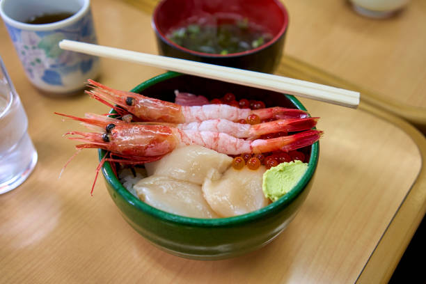 Sapporo fresh seafood rice bowl in japanese style in fish market morning meal.