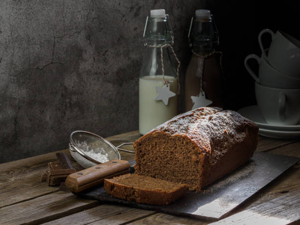 Cholocate sponge cake snack in a rustic atmosphere accompanied by a chocolate and milk drink