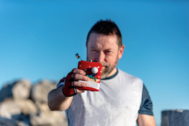 Portrait Of Man Holding Molotov Cocktail At Night