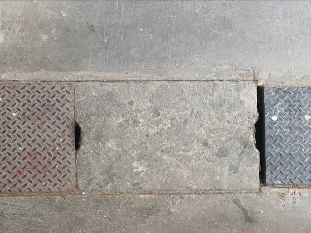 istock Concrete and Metal Drain Cover with Grated Surface 2197045794