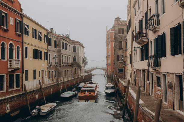 Scenic canal with ancient buildings in Venice, Italy