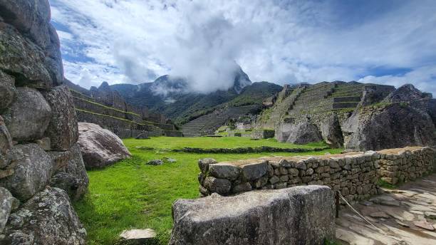 istock Ancient stone buildings inside ruins of Machu Picchu 2197048713