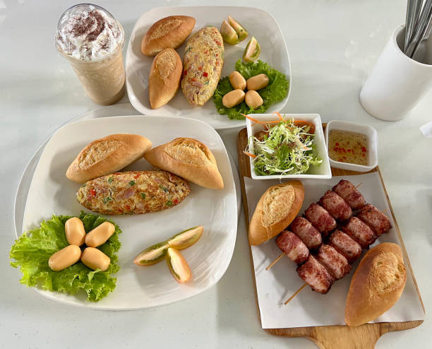 istock Vietnamese-style breakfast set with baguette, omelette, sausage, and bacon 2197049015