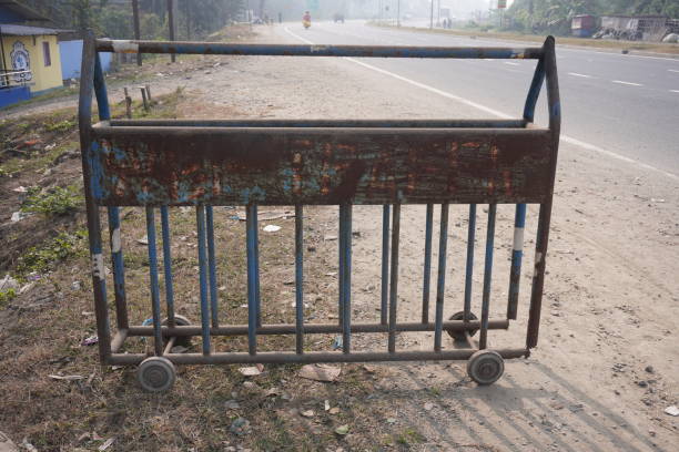 istock Road safety barrier with metal wheels on it 2197049156