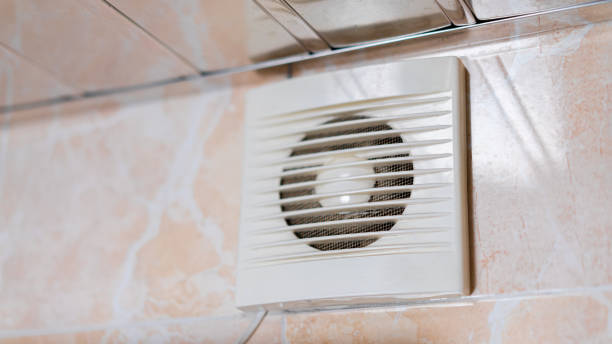 istock Bathroom ventilation fan mounted on tiled wall for improved air circulation and moisture control 2197050086