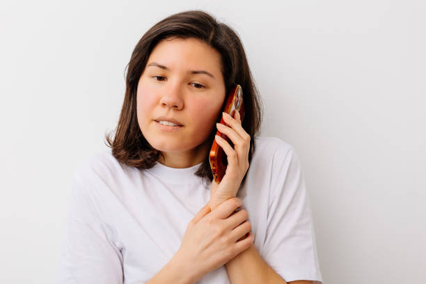 Worried Woman Talking on a Mobile Phone