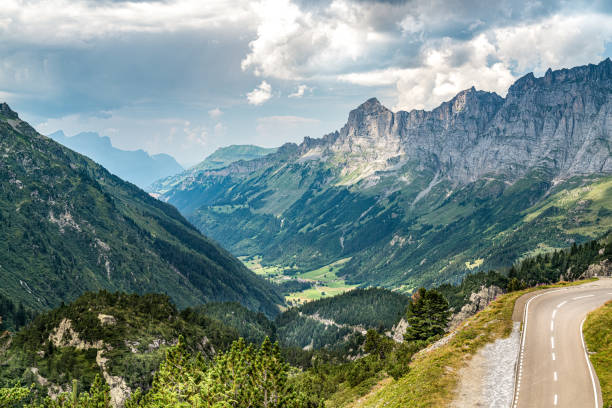 istock A mountain range in the Swiss Alps with a road running through it 2197051768