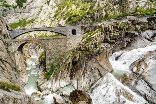 istock A mountain range in the Swiss Alps with a river running through it devil's bridge 2197052130