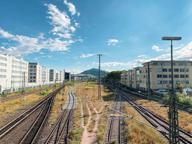 istock Train track with a city in the background 2197053364