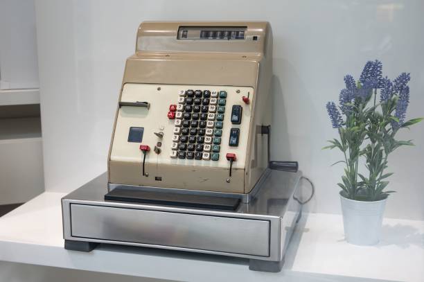 Detail of an old HUGIN brand cash register machine displayed on the display of a store
