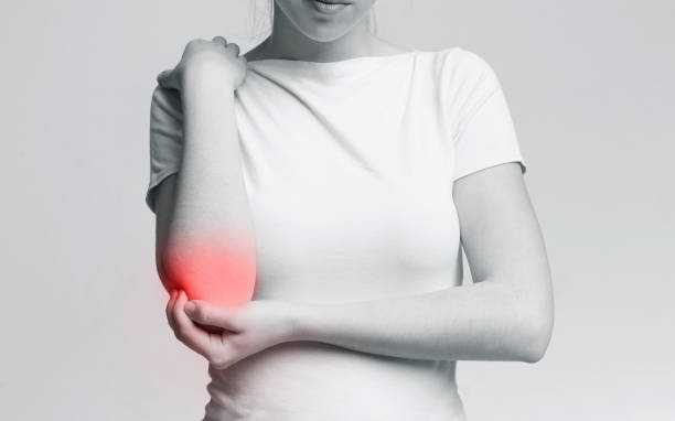 istock Cropped young woman suffering from painful elbow 2197058286