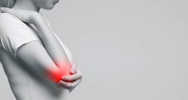 istock Cropped young woman suffering from painful elbow 2197058328