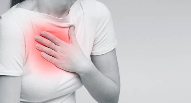 istock Woman with chest pain touching her breast 2197058347