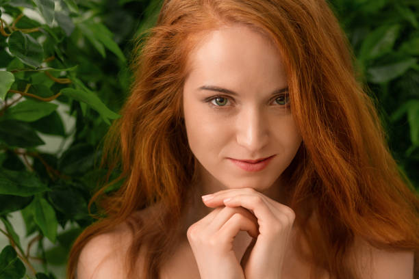 istock Sensual nude redhead woman looking at camera 2197058631